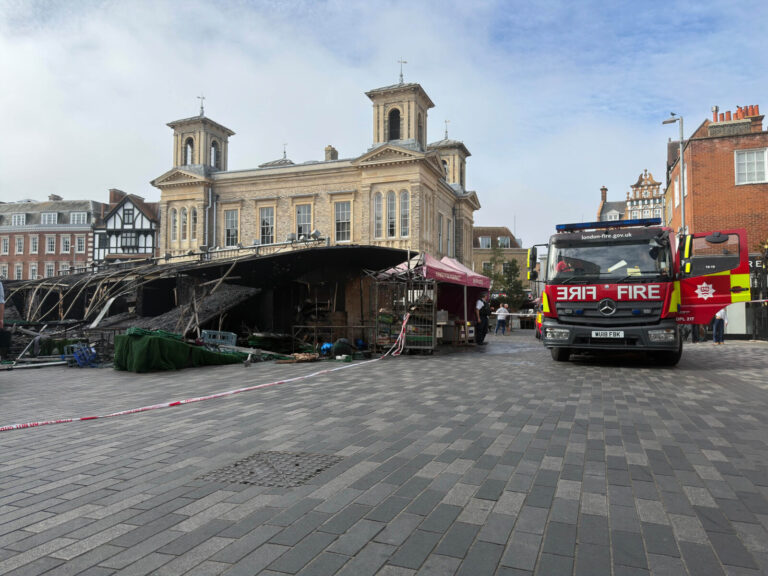 Eight people evacuated as fire tears through historic Kingston market